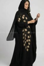 Nida Black Kaftan Abaya for women in Pakistan with Embroidery and a matching scarf in Chiffon Fabric.