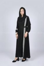 Black modern maxi abaya with an elegant strip design on one side, offering a sleek and stylish look.