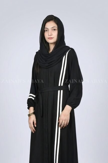 Black modern maxi abaya with an elegant strip design on one side, offering a sleek and stylish look.