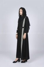 Black modern maxi abaya with an elegant strip design on one side, offering a sleek and stylish look.