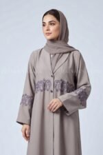 Coat Style Abaya in Light Grey Color featuring embroidery as well as matching scarf in chiffon fabric.