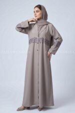 Coat Style Abaya in Light Grey Color featuring embroidery as well as matching scarf in chiffon fabric.