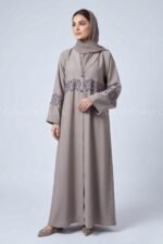 Coat Style Abaya in Light Grey Color featuring embroidery as well as matching scarf in chiffon fabric.