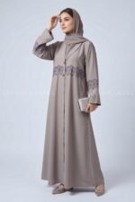 Coat Style Abaya in Light Grey Color featuring embroidery as well as matching scarf in chiffon fabric.
